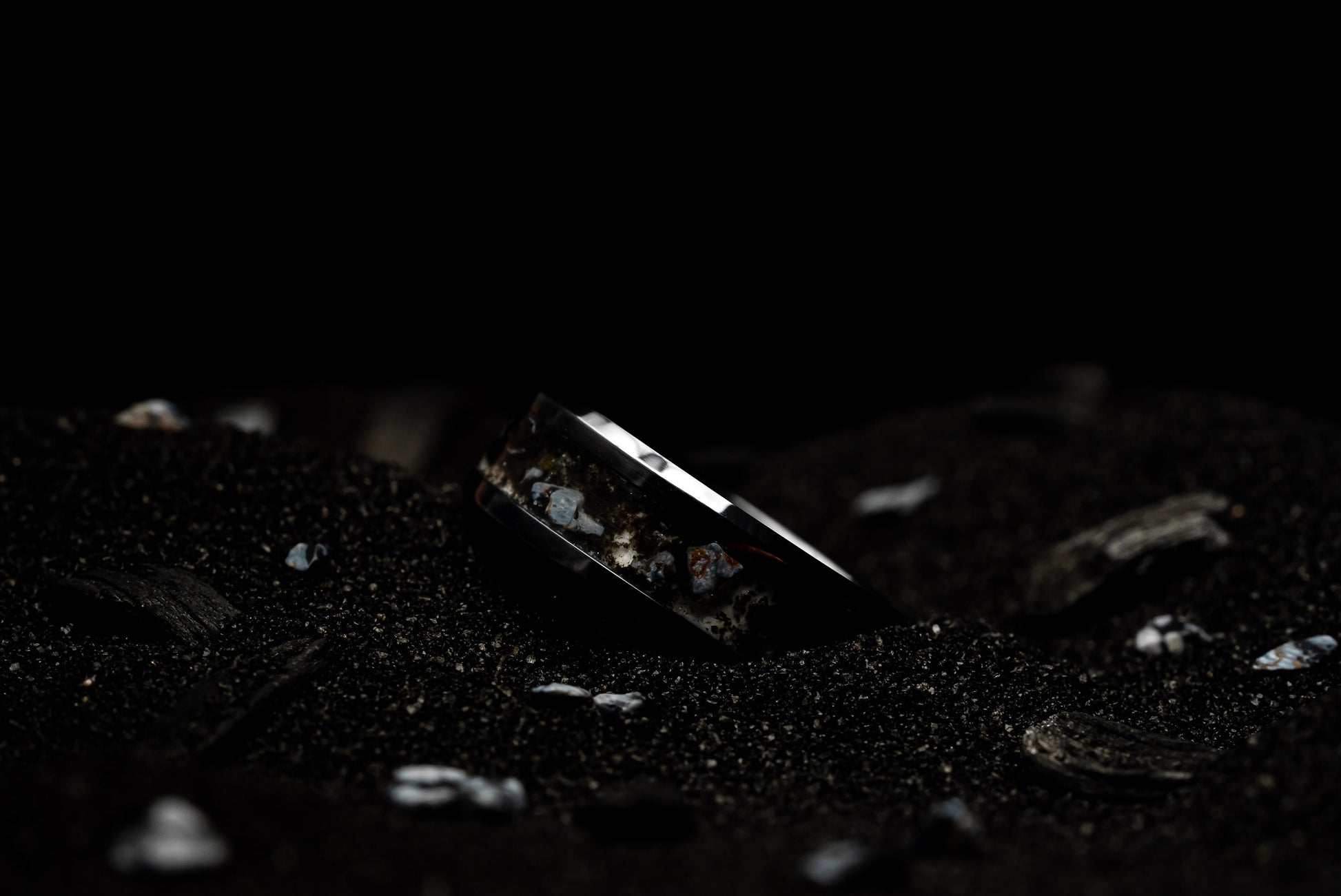 Smoldering Snow | Snowflake Obsidian and Crushed Icelandic Lava with Orange/Red Glow.